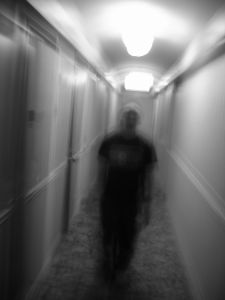 Shadowy figure in a hallway