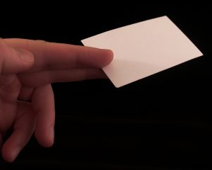 Hand offering a blank business card