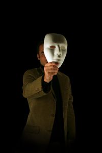 Man taking off mask