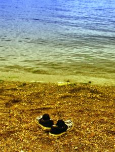 Where are you? Empty shoes on an empty beach