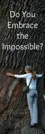 Woman hugging a tree bigger than she can get her arms around