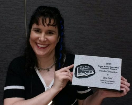 Jami Gold holding stone plaque for National Readers' Choice Award for Ironclad Devotion