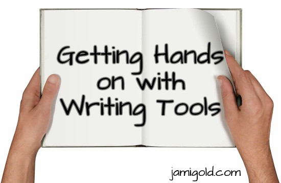 Hands holding an open book with text on pages: Getting Hands on with Writing Tools