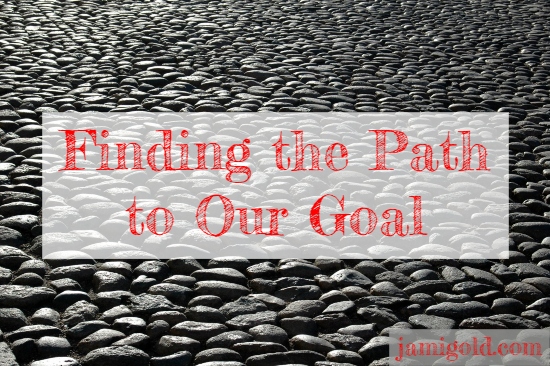 Featureless stone-covered expanse with text: Finding the Path to Our Goal