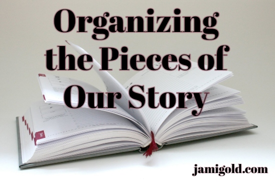 Planner book open on a surface with text: Organizing the Pieces of Our Story